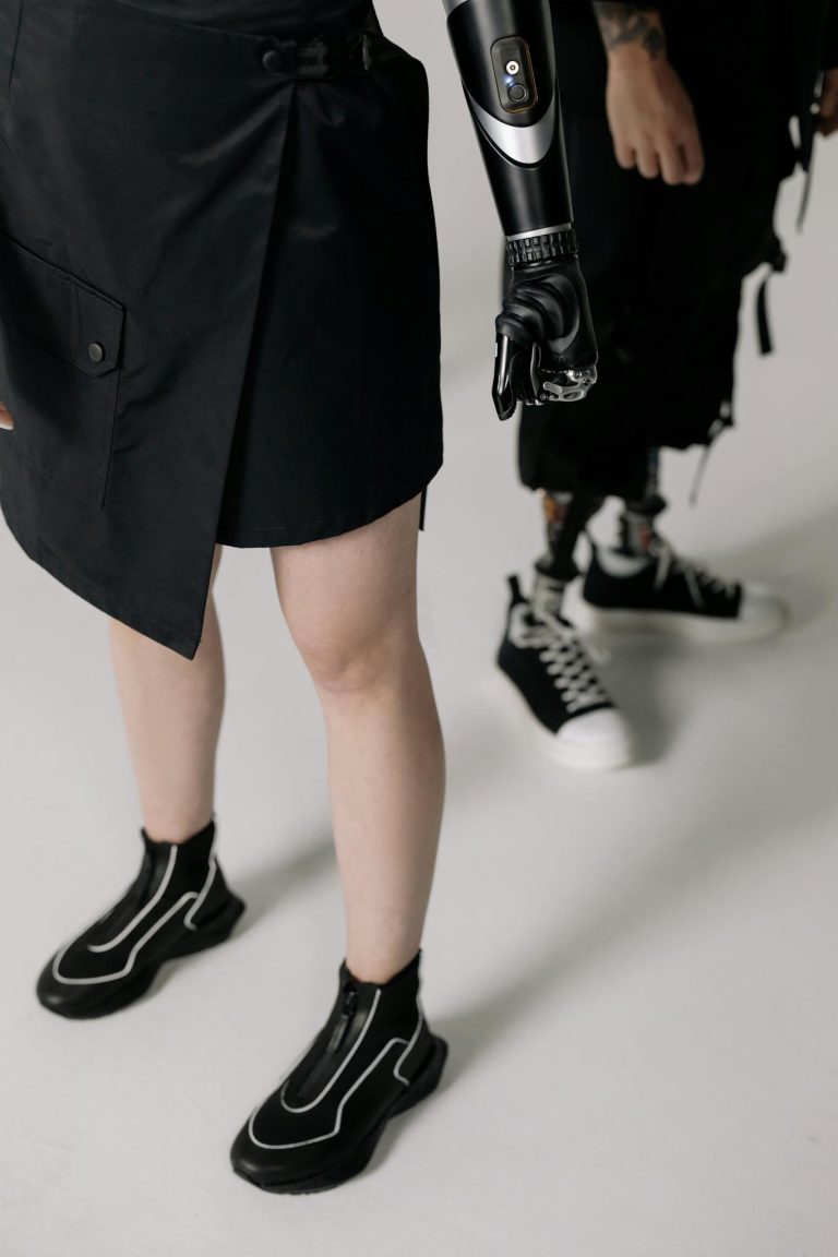 Close-up of stylish modern prosthetics and fashion-forward attire in a studio setting.
